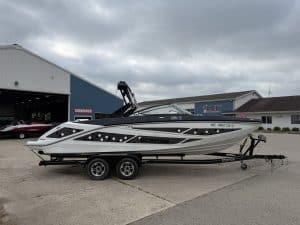 2021 Scarab 255ID speedboat on trailer outside Hall's Sport Center.