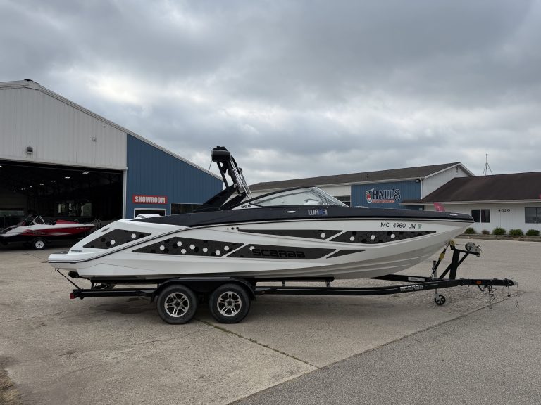 2021 Scarab 255ID speedboat on trailer outside Hall's Sport Center.
