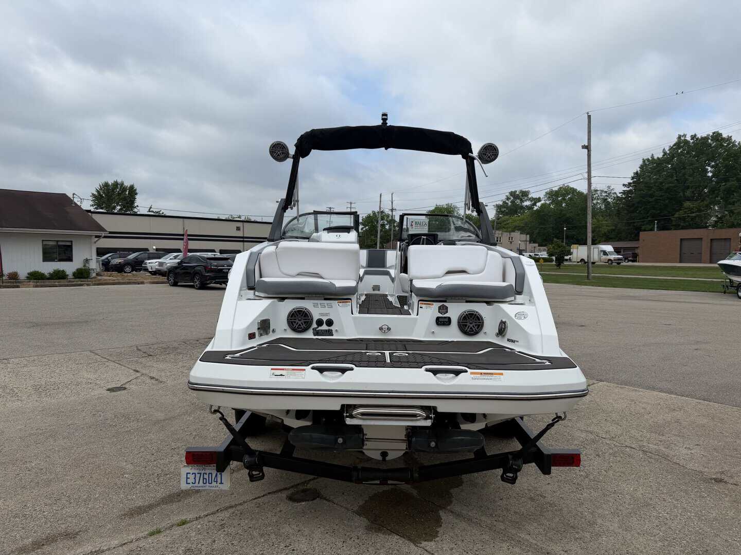2021 Scarab 255ID luxury boat on trailer at marina.