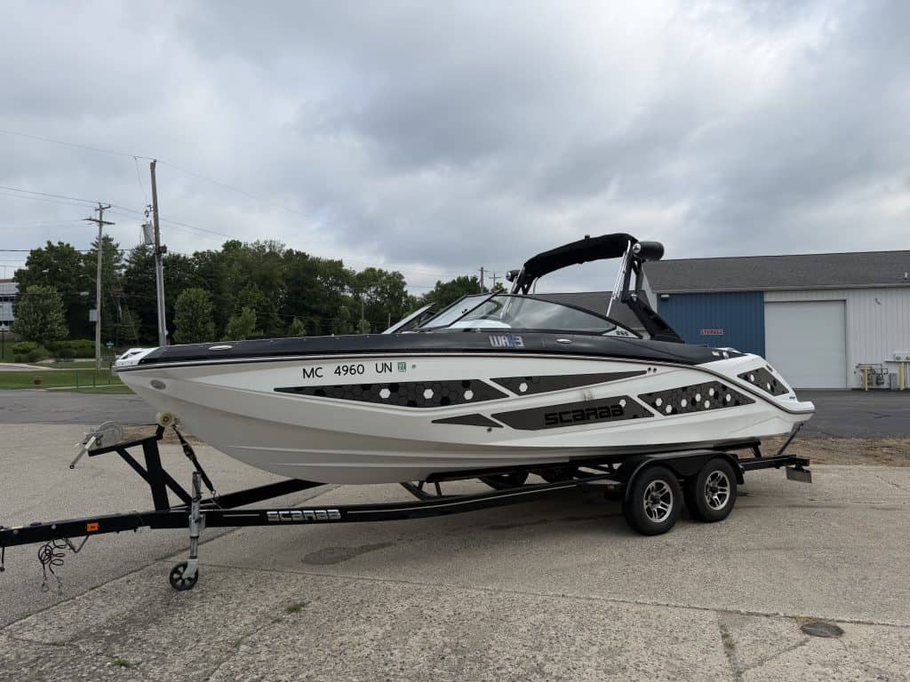 Scarab 255ID powerboat on trailer at Hall's Sport Center.