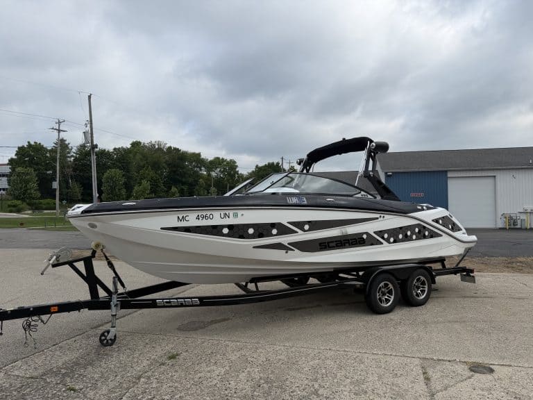 Scarab 255ID powerboat on trailer at Hall's Sport Center.