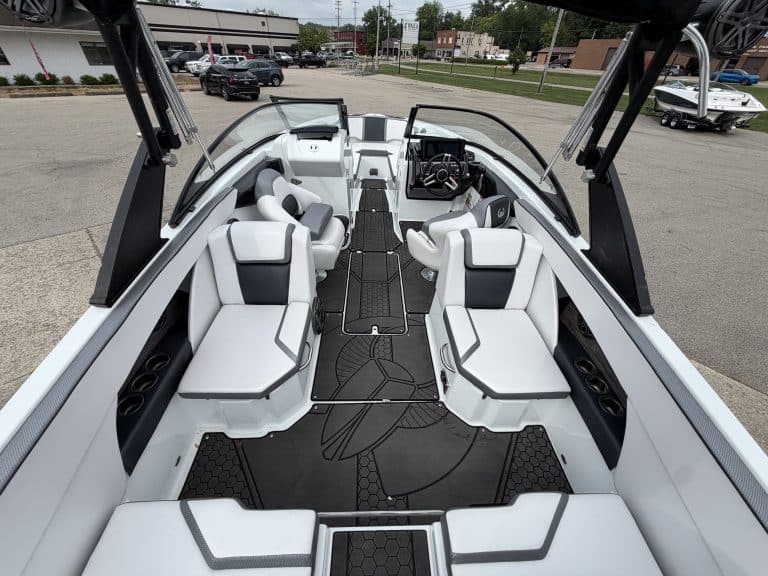 Interior view of a Scarab 255ID boat with seating and steering console.