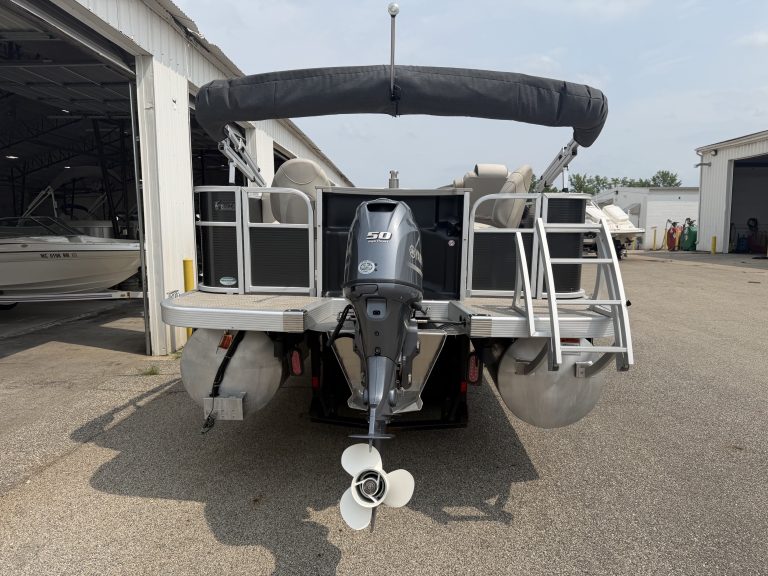 Bennington 21 SS pontoon boat with outboard motor at Hall's Sport Center.