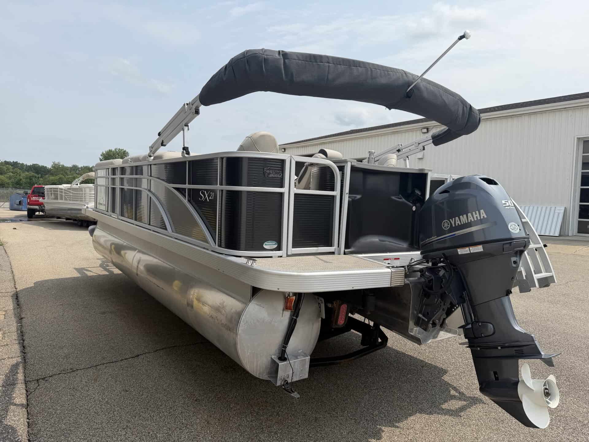 Bennington 21 SS pontoon boat with Yamaha engine and canopy.