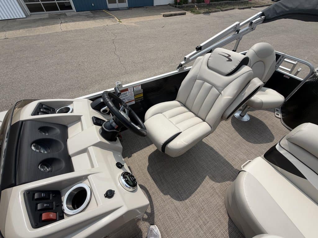Close-up of the helm and seating area of a Bennington 21 SS pontoon boat.