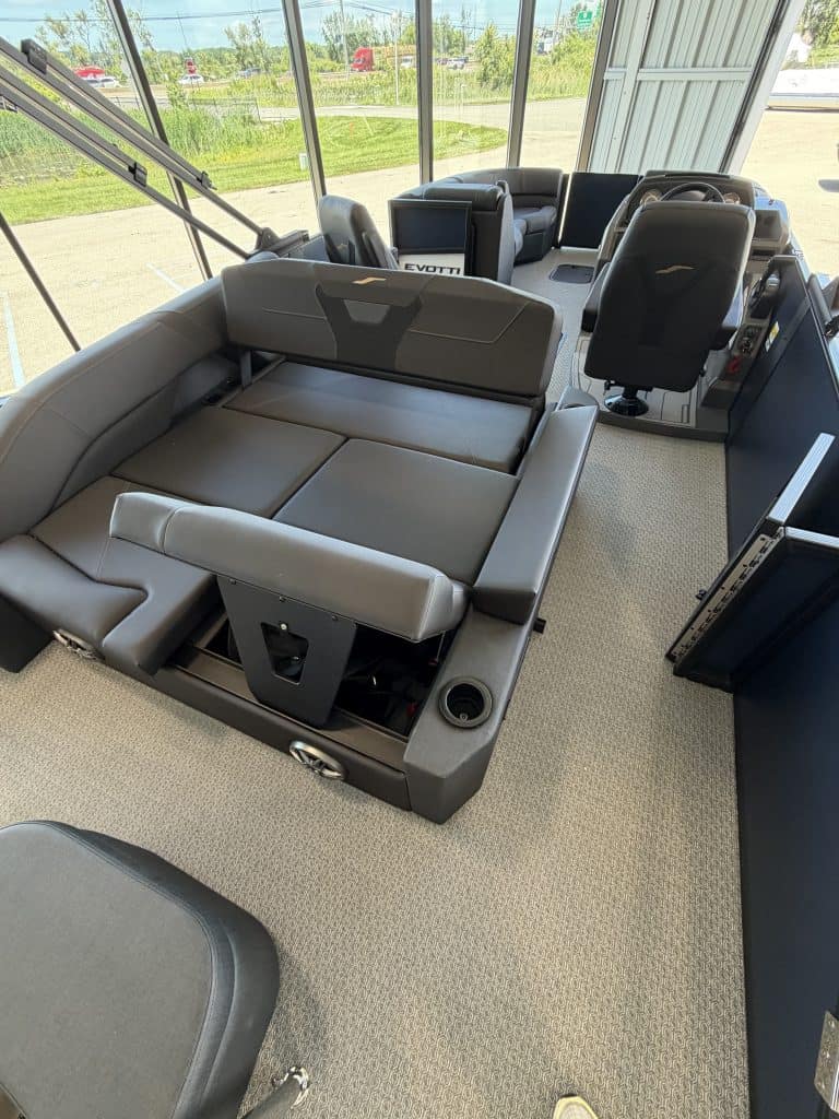 Bus interior with seating and control panel at Hall's Sport Center.