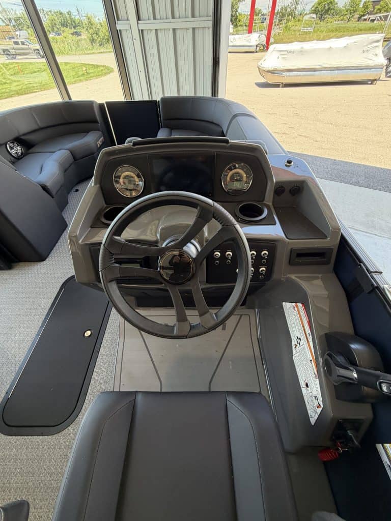 Golf cart dashboard with steering wheel and controls at Hall's Sport Center.