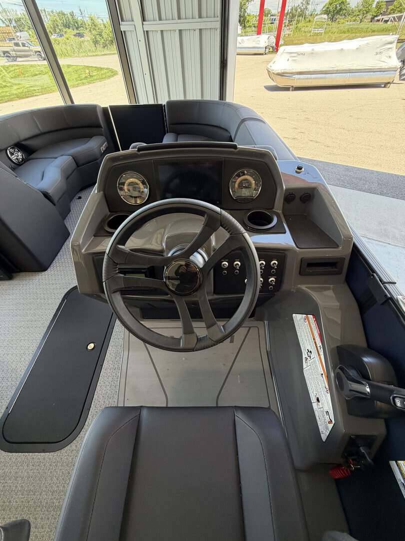 Golf cart dashboard with steering wheel and controls at Hall's Sport Center.