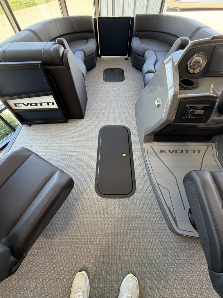 Interior view of EVOTTI 521CS boat with seating and controls.