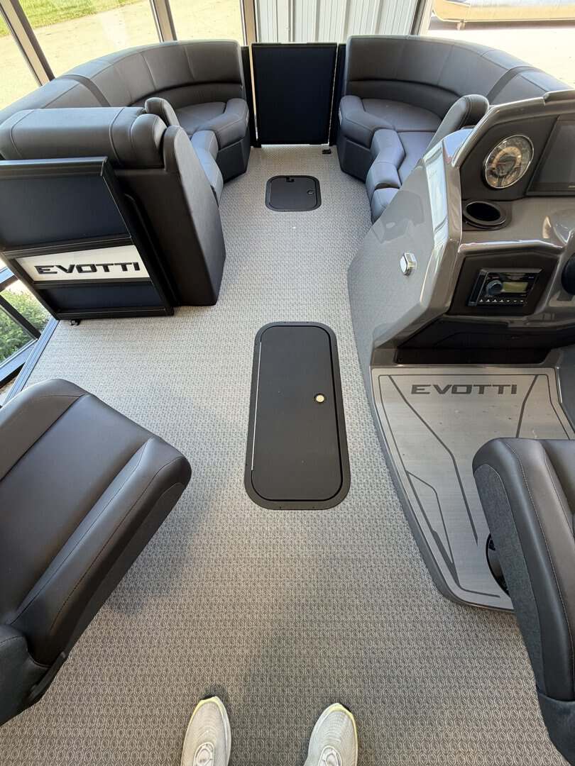 Interior view of EVOTTI 521CS boat with seating and controls.