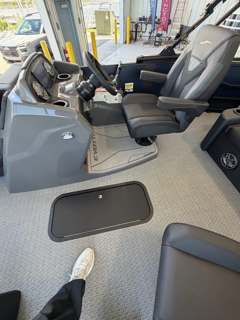 Comfortable bus driver seat in EVOTTI 521CS vehicle at Hall's Sport Center.