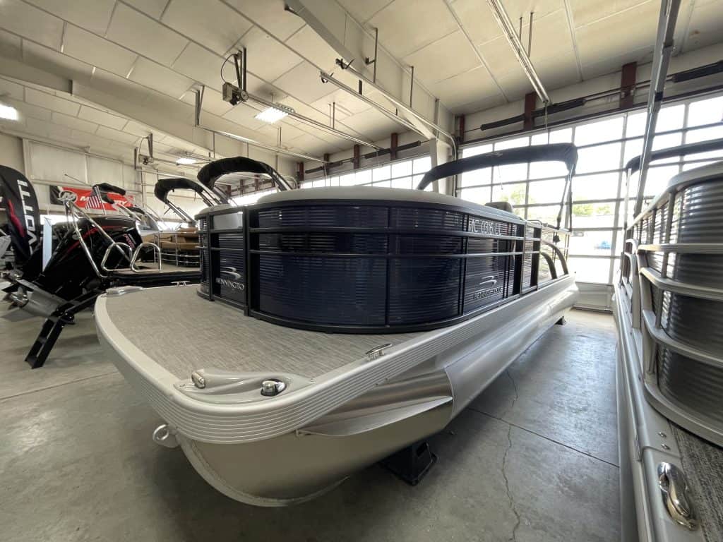 Pontoon boat displayed at Hall's Sport Center, showcasing premium watercraft and boating accessories.