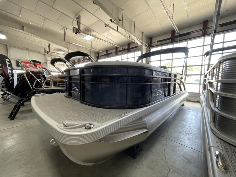 Pontoon boat displayed at Hall's Sport Center, showcasing premium watercraft and boating accessories.
