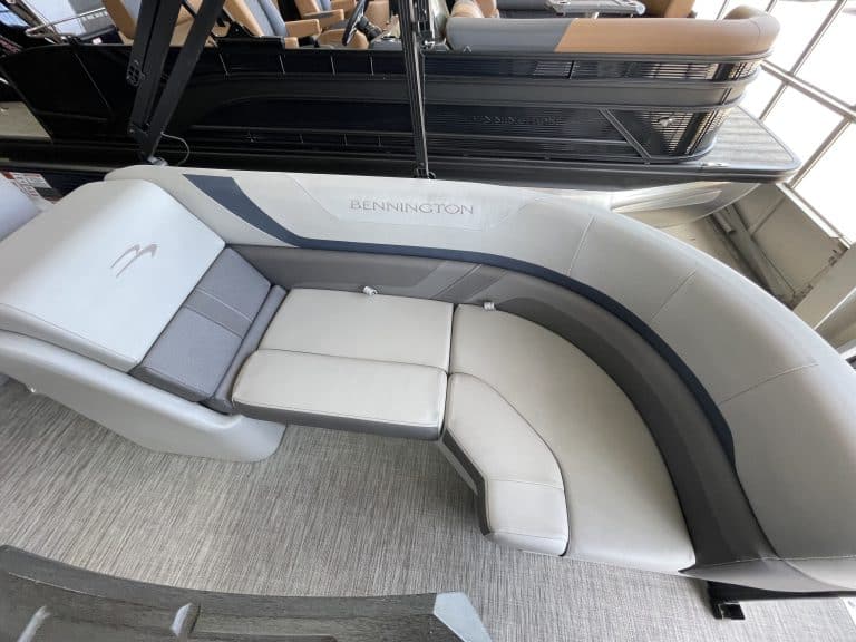 Bennington boat lounge seating with comfortable cushions and modern design at Hall's Sport Center.