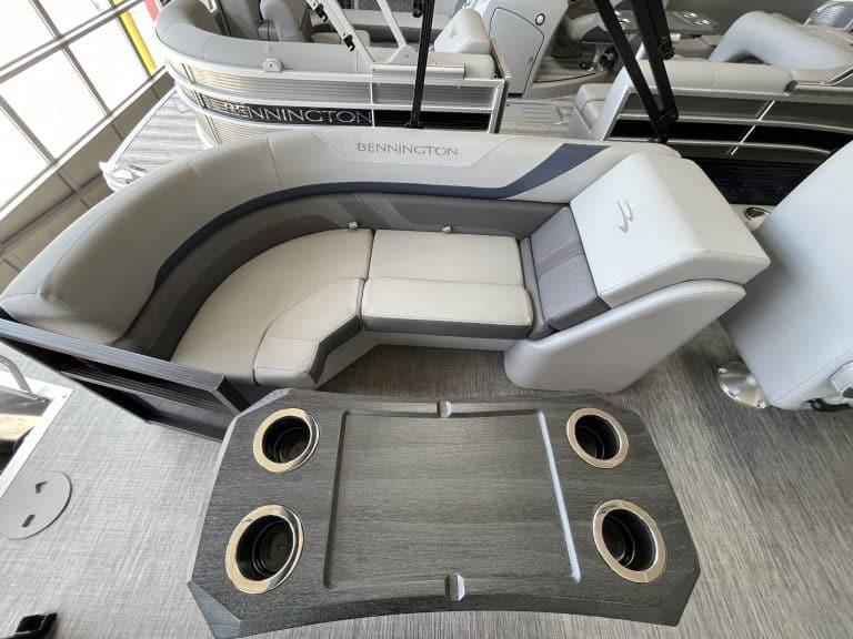 Bennington pontoon boat with comfortable seating and built-in cup holders at Hall's Sport Center.