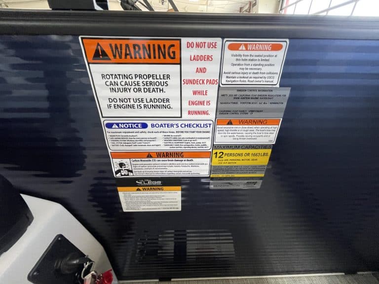 Warning sign about rotating propeller hazards and safety precautions.