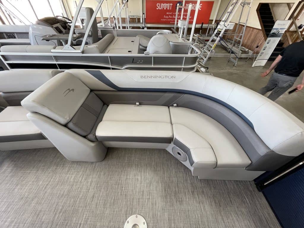 Pontoon boat lounge with comfortable cushioned seats and modern design.