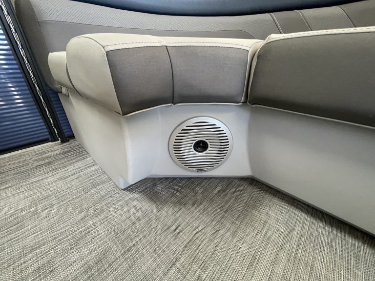 Comfortable, stylish lounge area with cushioned seats and built-in speaker system.