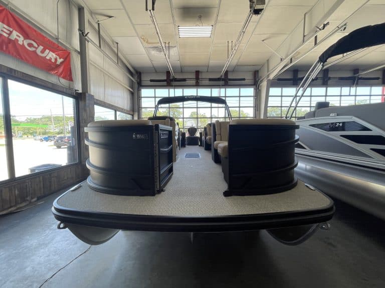 Pontoon boat at Hall's Sport Center with spacious deck and seating.