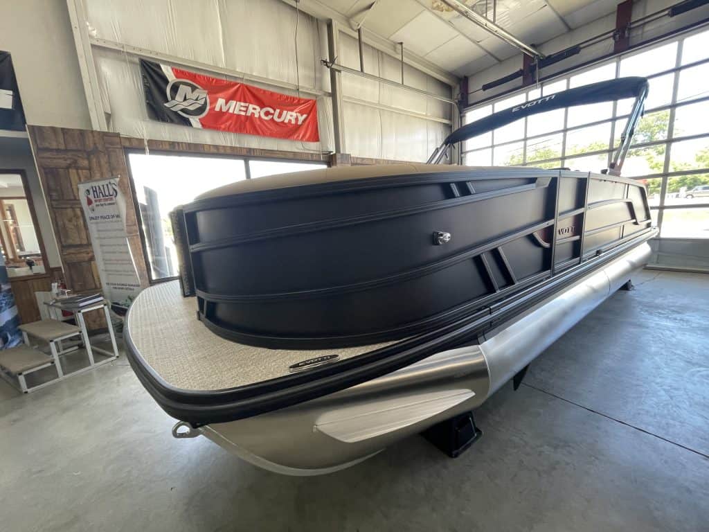 Luxury pontoon boat at Hall's Sport Center for sale or display.