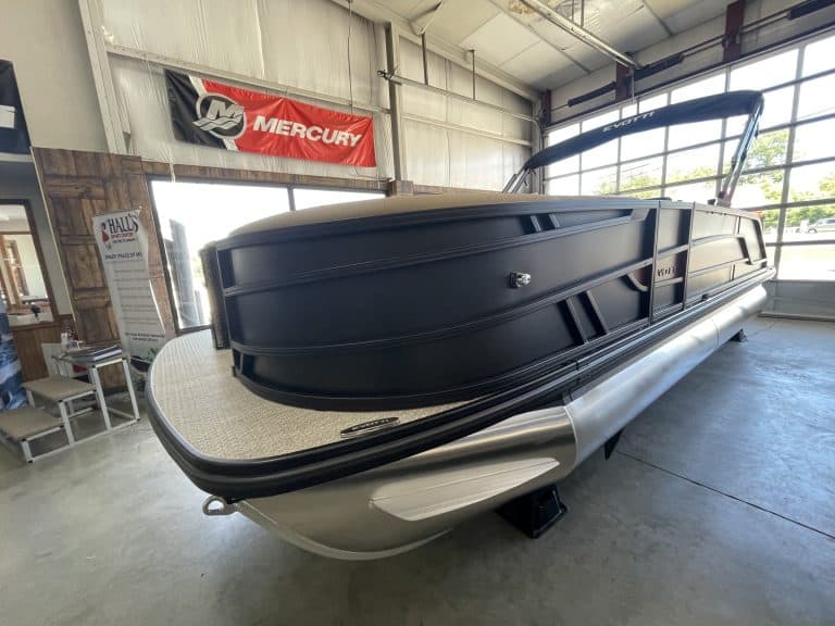 Luxury pontoon boat at Hall's Sport Center for sale or display.