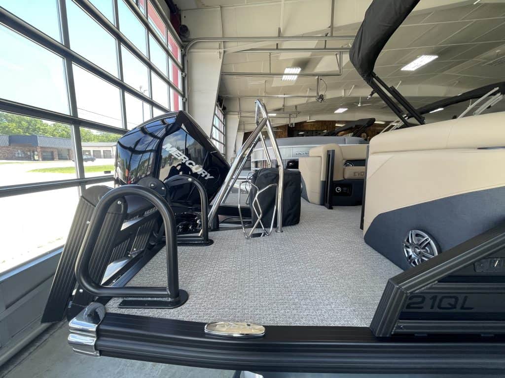 Indoor boat display at Hall's Sport Center with various boat models.