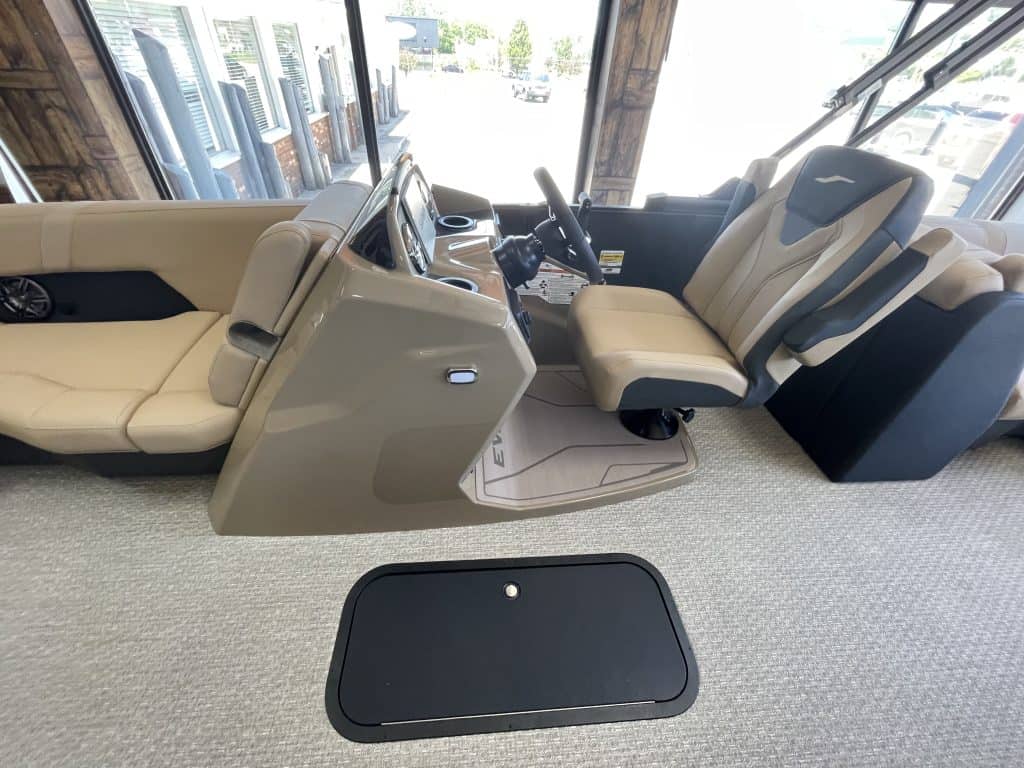 Interior view of a luxury golf cart at Hall's Sport Center with beige seats and dashboard.