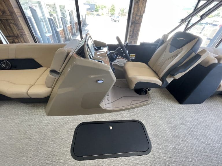 Interior view of a luxury golf cart at Hall's Sport Center with beige seats and dashboard.