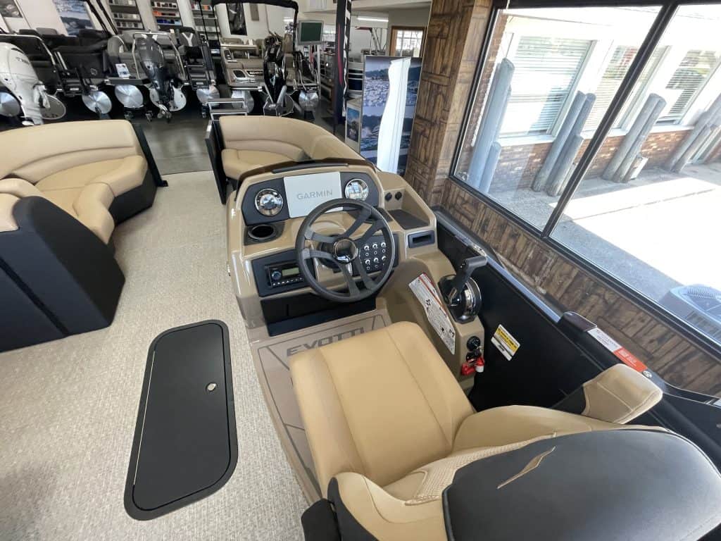 Boat helm station with steering wheel and navigation controls at Hall's Sport Center.