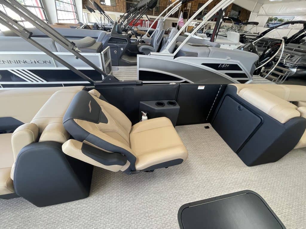 Luxury boat interior with captain's seat and spacious seating area.