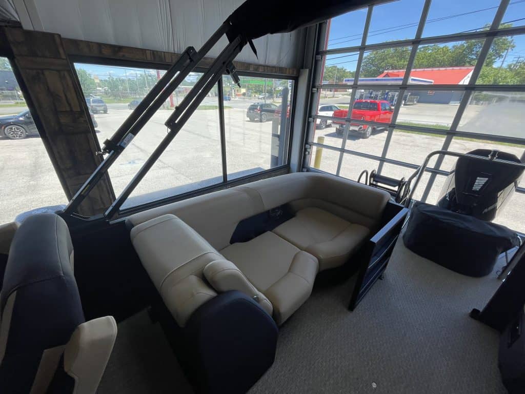 Comfortable indoor seating area at Hall's Sport Center with large windows.