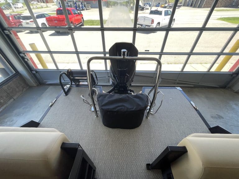 Electric scooter at Hall's Sport Center with large window view.