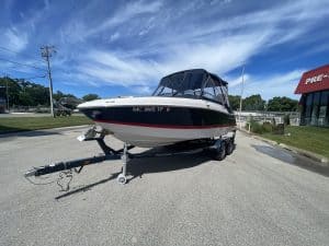 Four Winns 215 SUNDOWNER boat on trailer at Hall's Sport Center.