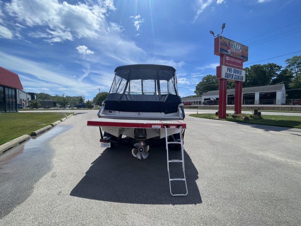 Four Winns 215 SUNDOWNER boat on trailer at Hall's Sport Center.