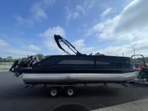 Luxury pontoon boat on trailer at Hall's Sport Center.