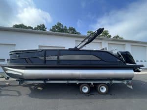 Luxury pontoon boat on trailer at Hall's Sport Center.