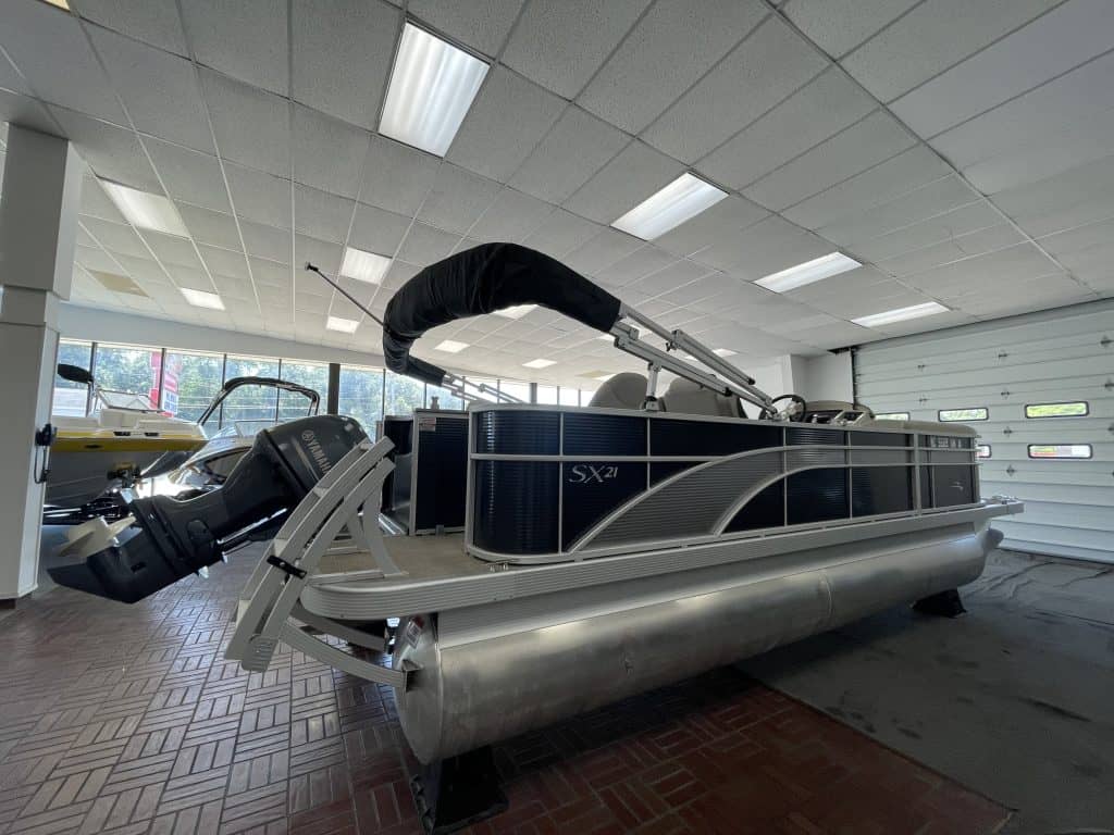 Bennington 21 SS pontoon boat inside Hall's Sport Center.