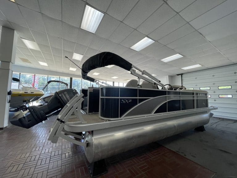Bennington 21 SS pontoon boat inside Hall's Sport Center.