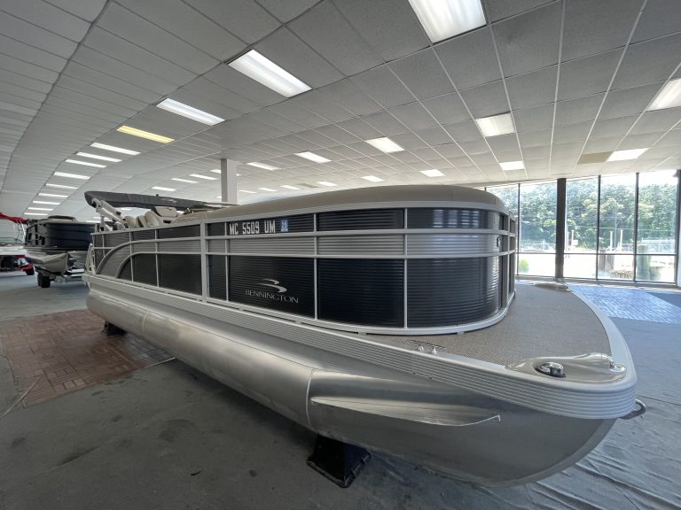 Bennington 21 SS pontoon boat inside Hall's Sport Center showroom.