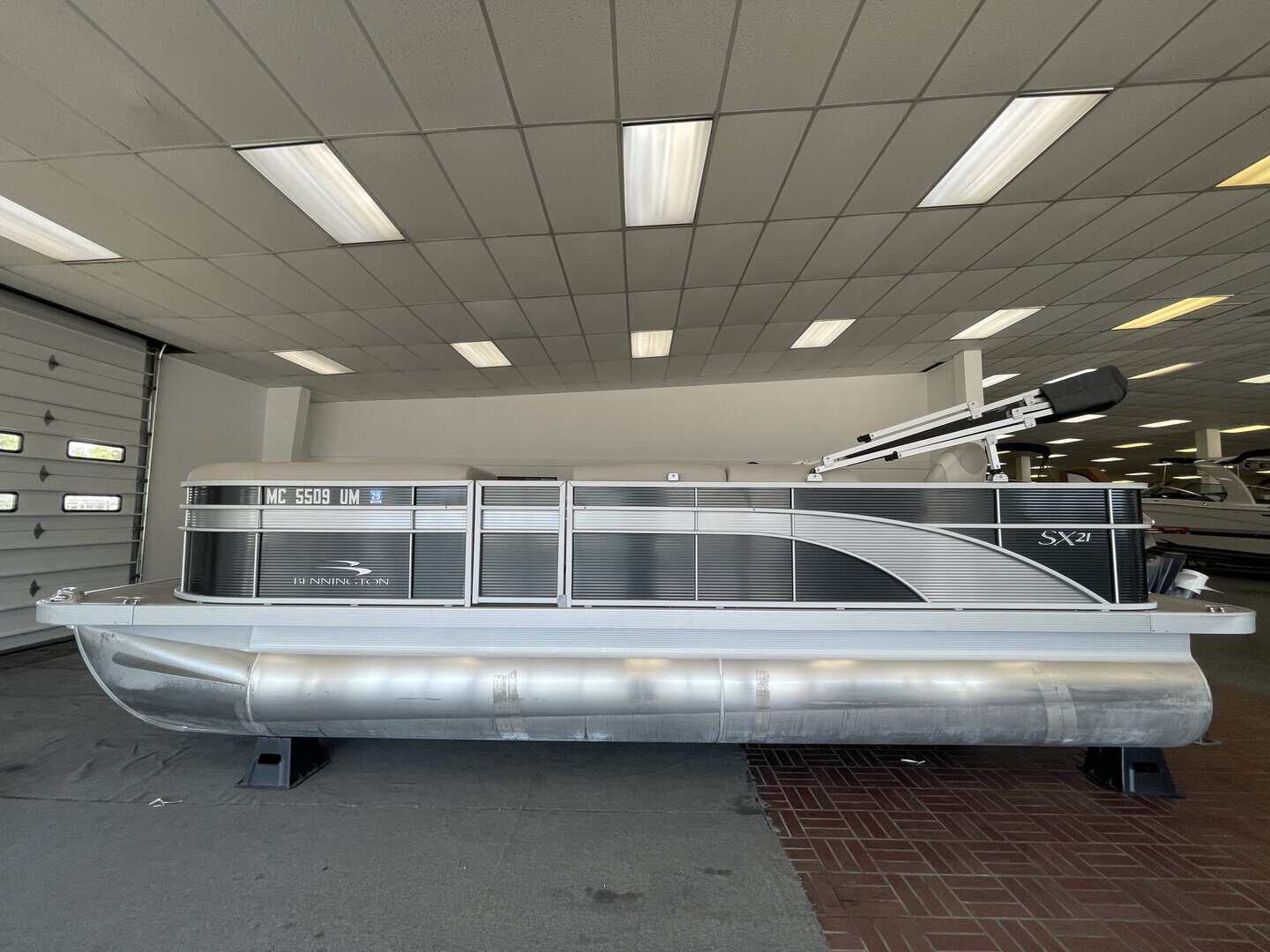 Bennington 21 SS pontoon boat displayed at Hall's Sport Center.