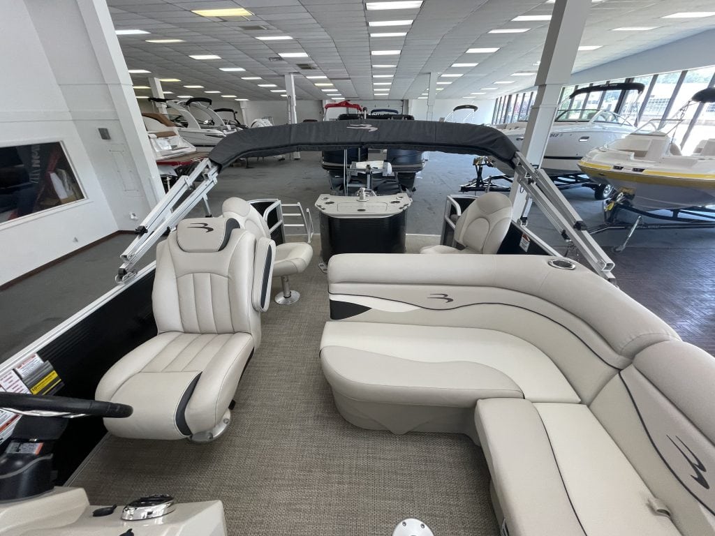 Luxury pontoon boat interior with spacious seating at Hall's Sport Center.