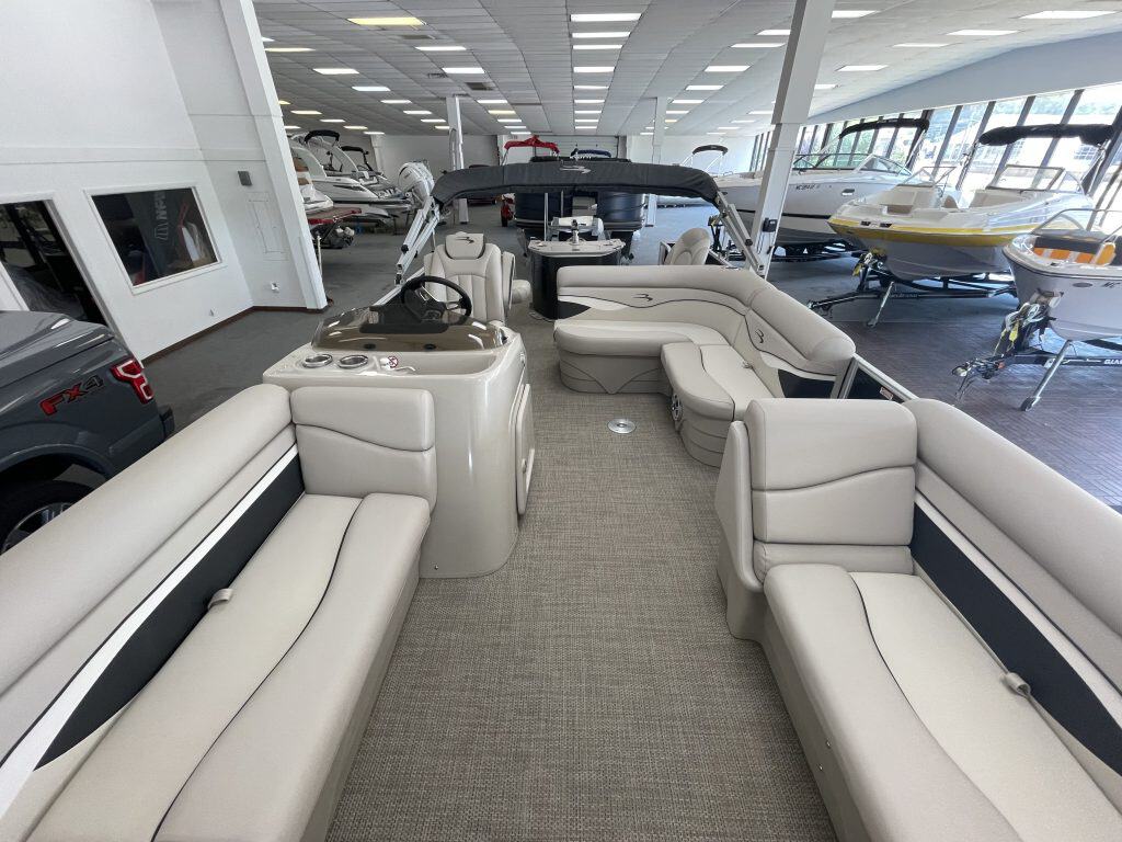 Luxury Bennington 21 SS pontoon boat inside Hall's Sport Center.