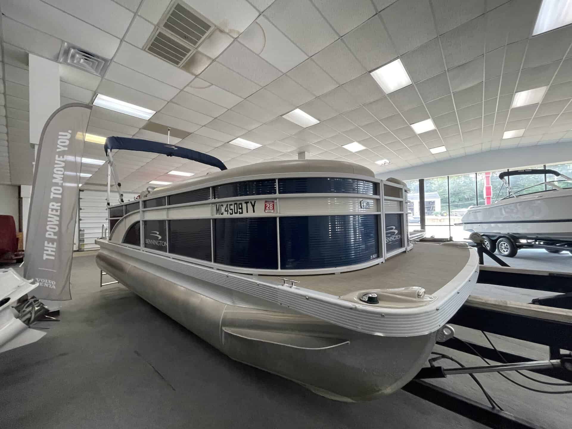 Bennington 21 SLX pontoon boat displayed at Hall's Sport Center.