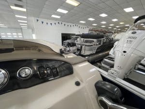 Bennington 21 SLX pontoon boat inside Hall's Sport Center.