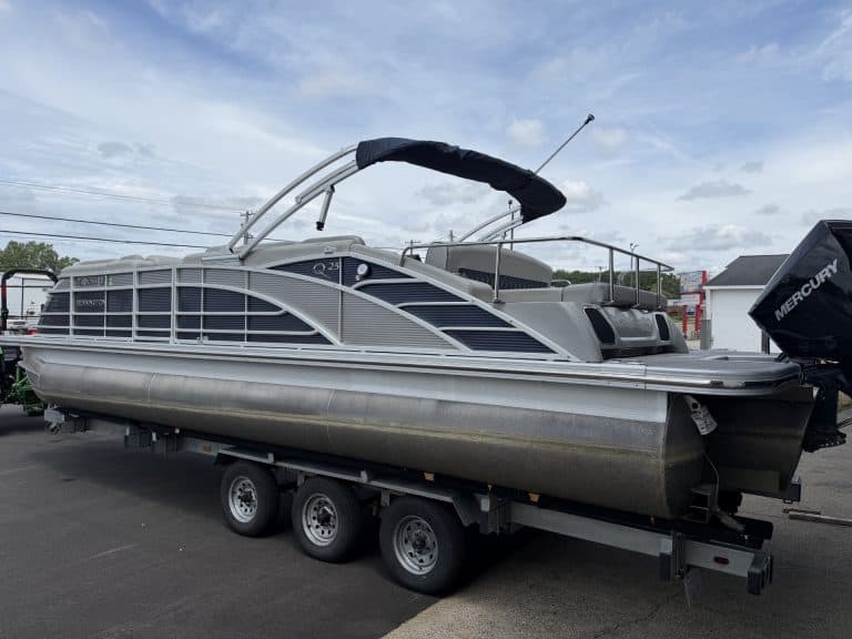 Bennington 25QSB pontoon boat on trailer at Hall's Sport Center.