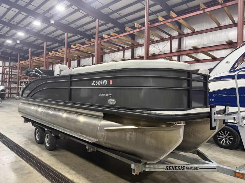 Pontoon boat inside Hall's Sport Center, ready for transport.