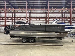 Harris 230 SBHL pontoon boat inside Hall's Sport Center.
