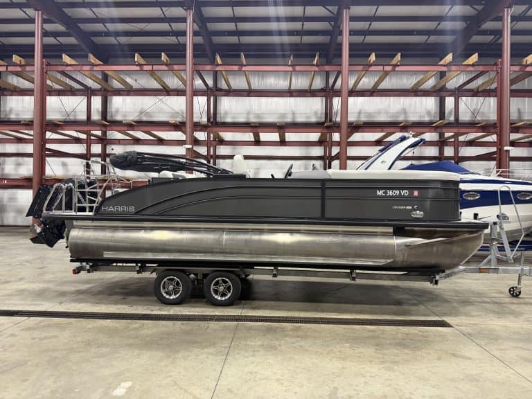 Harris 230 SBHL pontoon boat inside Hall's Sport Center.