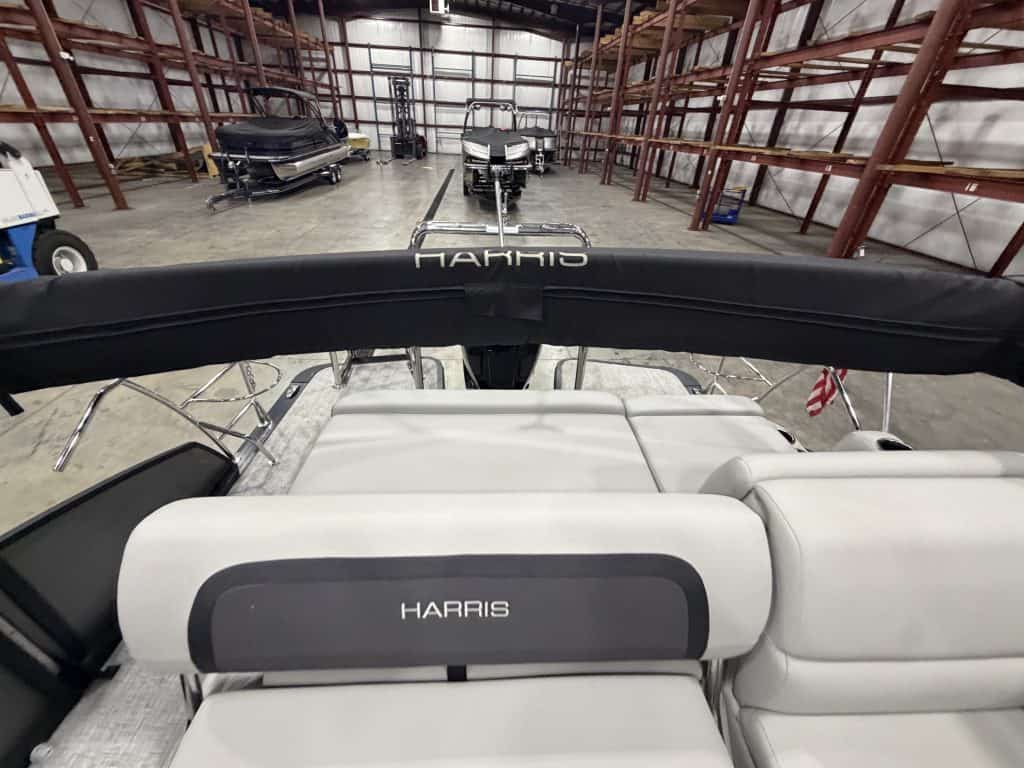 Harris boat inside Hall's Sport Center with other boats in the background.