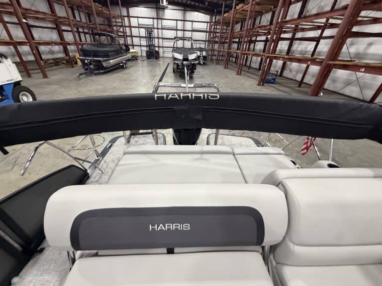 Harris boat inside Hall's Sport Center with other boats in the background.